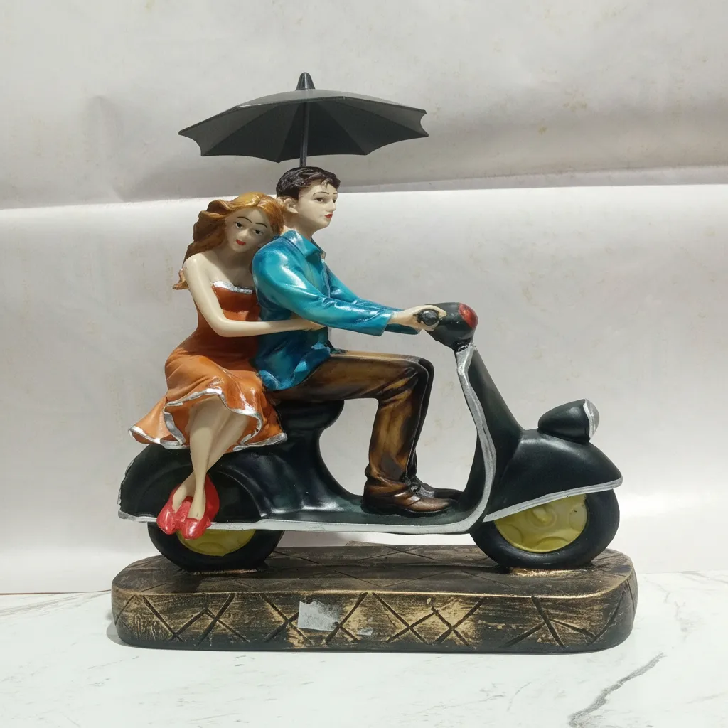 Couple on Scooter Figurine