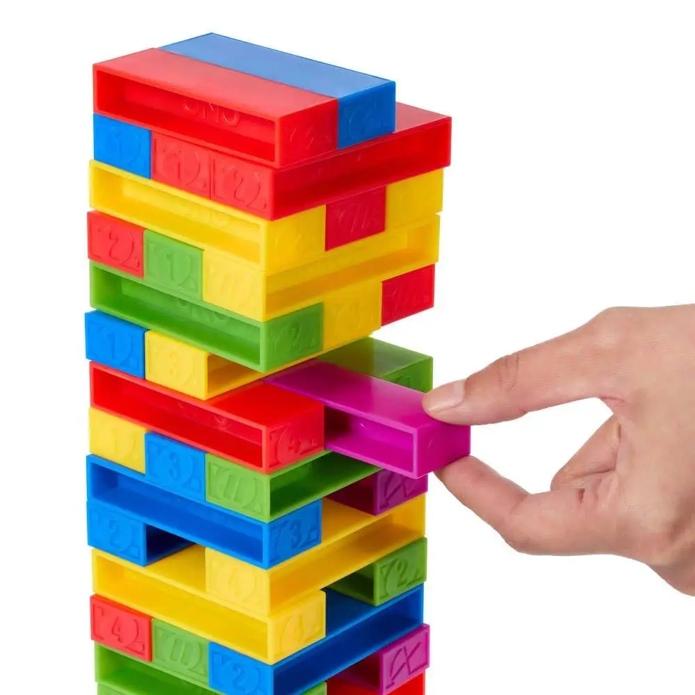 Mattel Games UNO Stacko Game for Kids & Family with 45 Colored Stacking Blocks & Loading Tray, Build & Play, Game Nights & Parties view 4