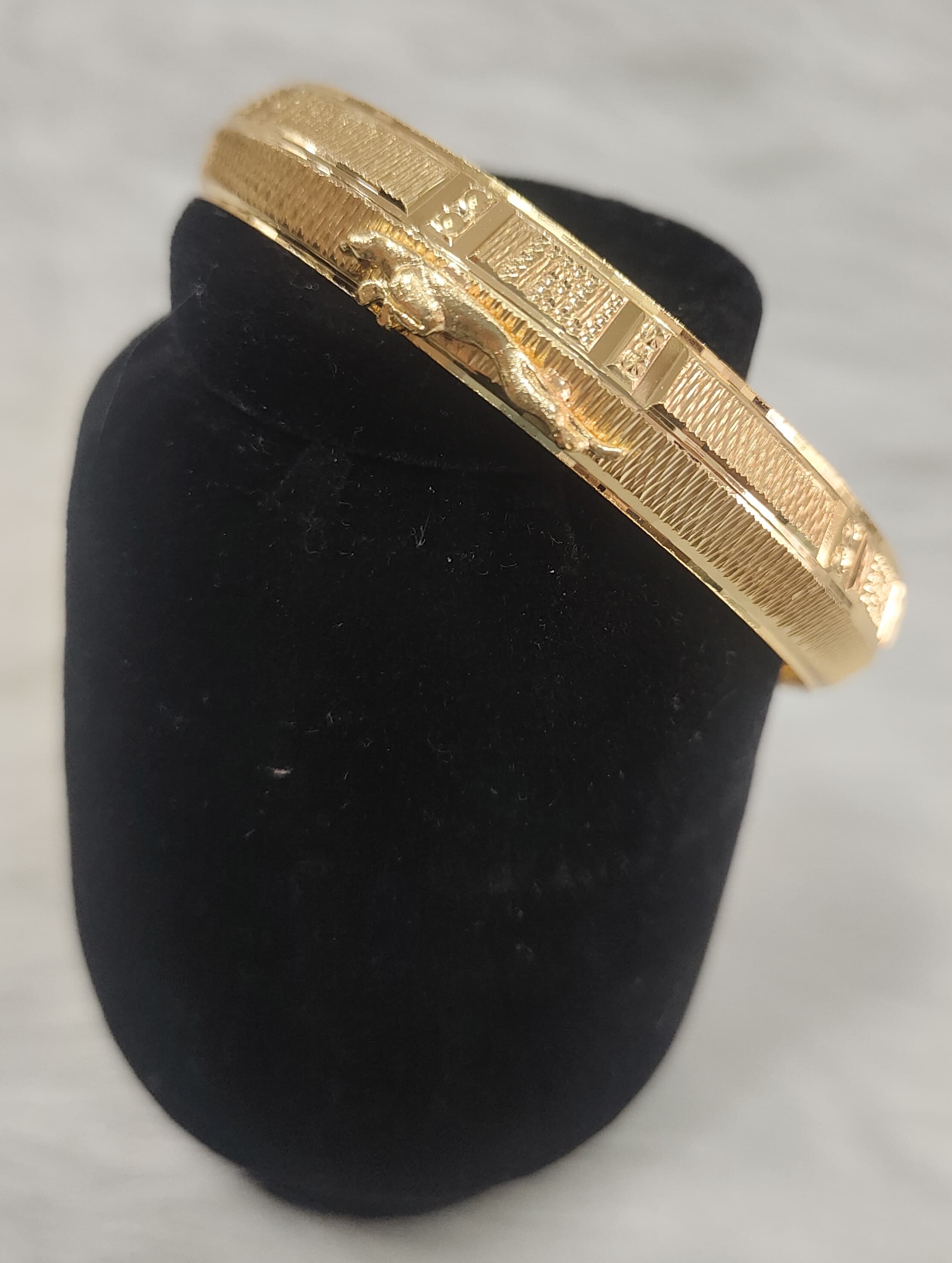Gold plated Kada for men features a textured finish and a detailed Jaguar view 2