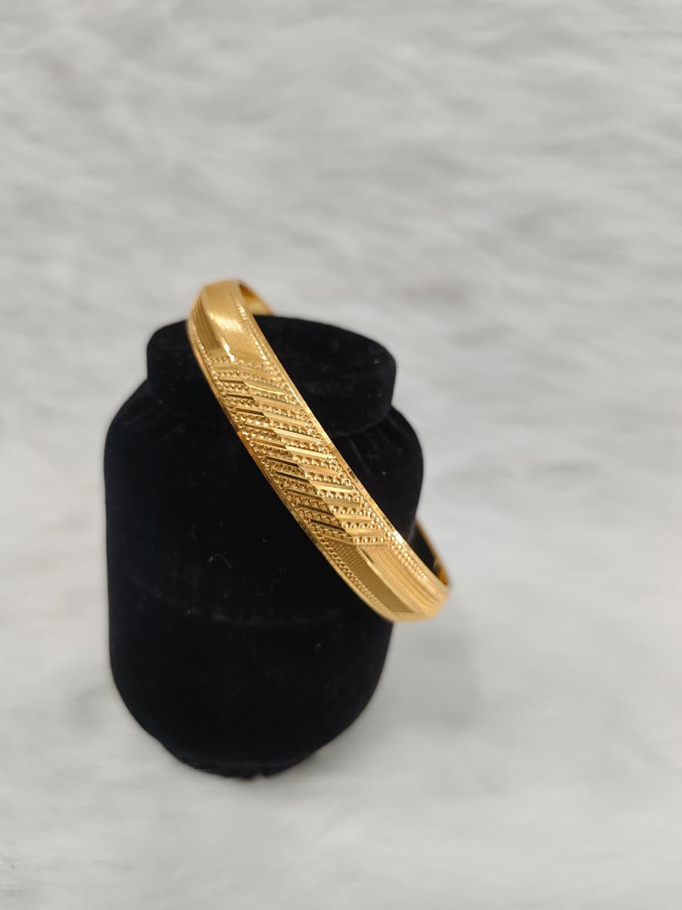 CaratLane 22KT Gold Plated Kada for Men features a polished finish with finely engraved linear textures view 3