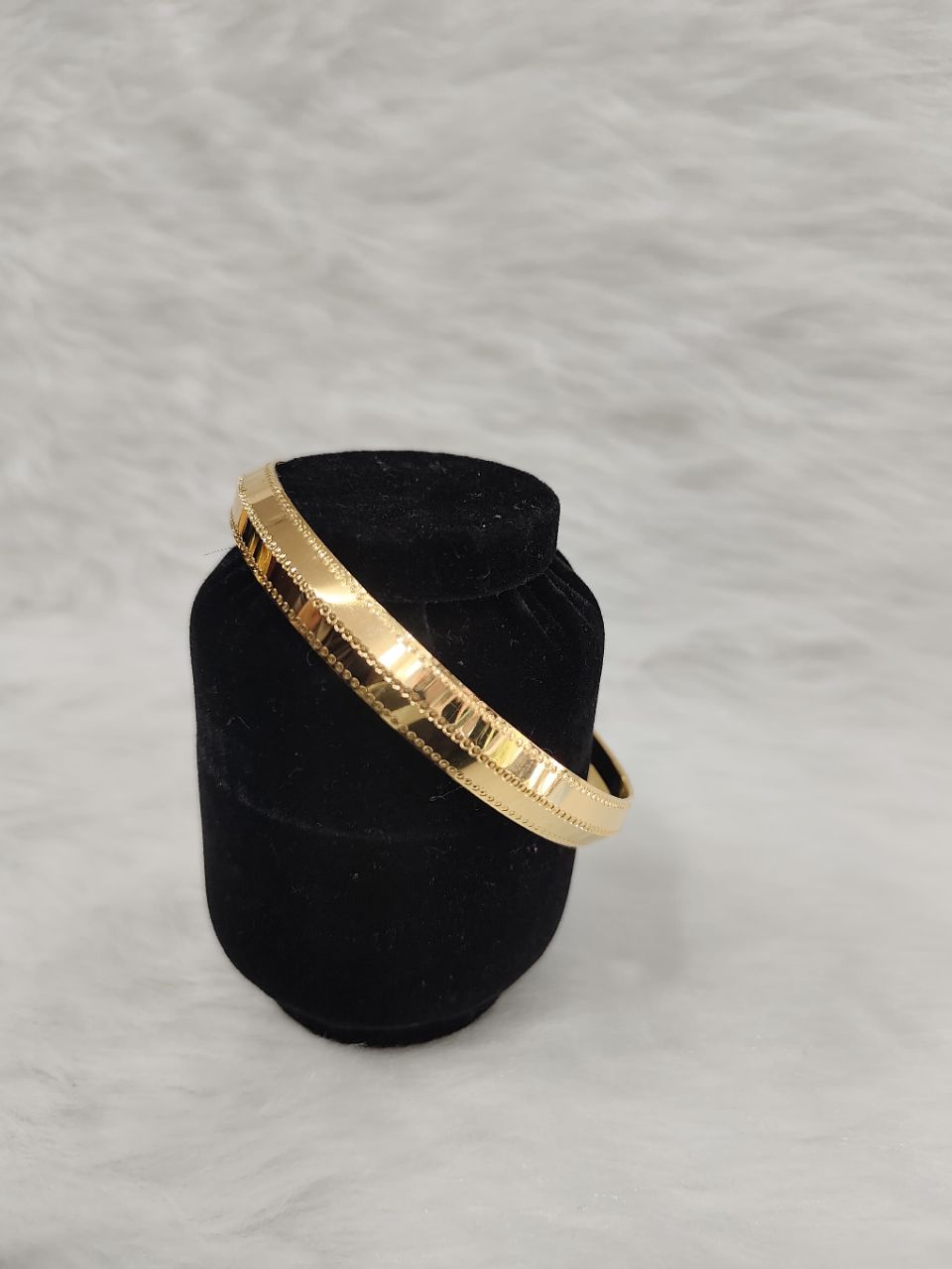 Regal 22KT gold plated kada for men features a polished finish with finely engraved linear textures view 3