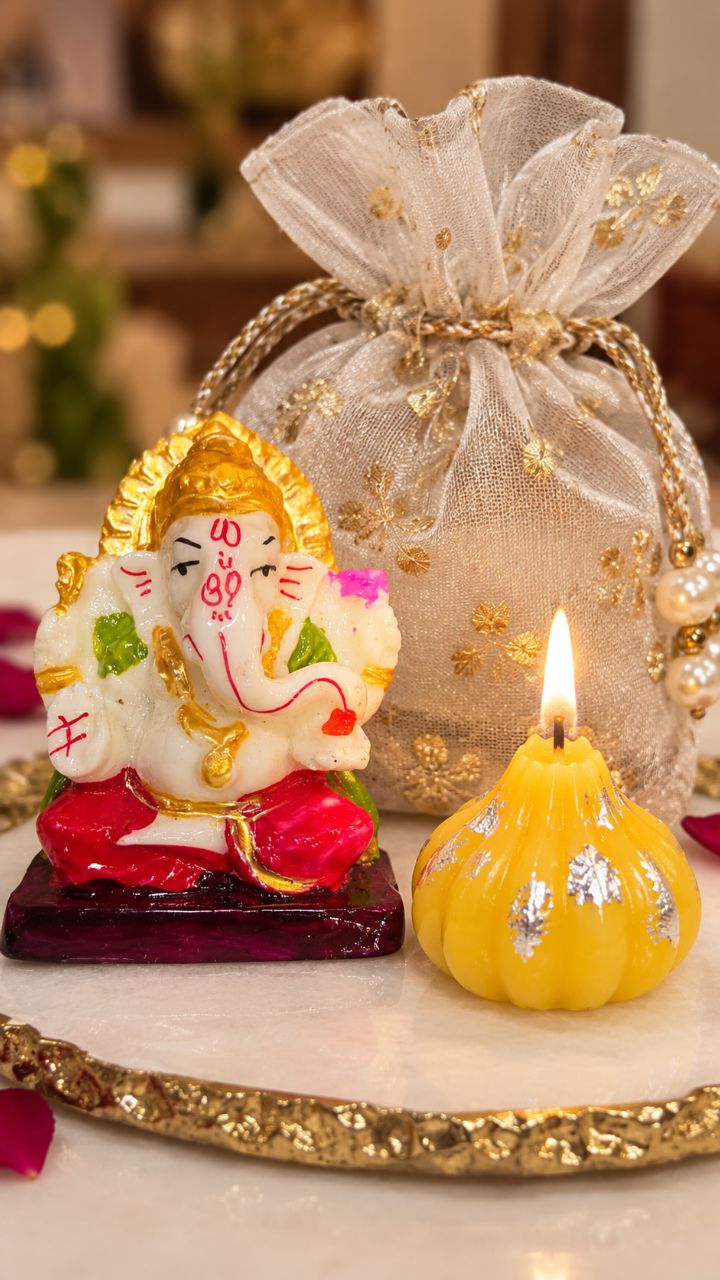 Ganesh Idol With modak Candle